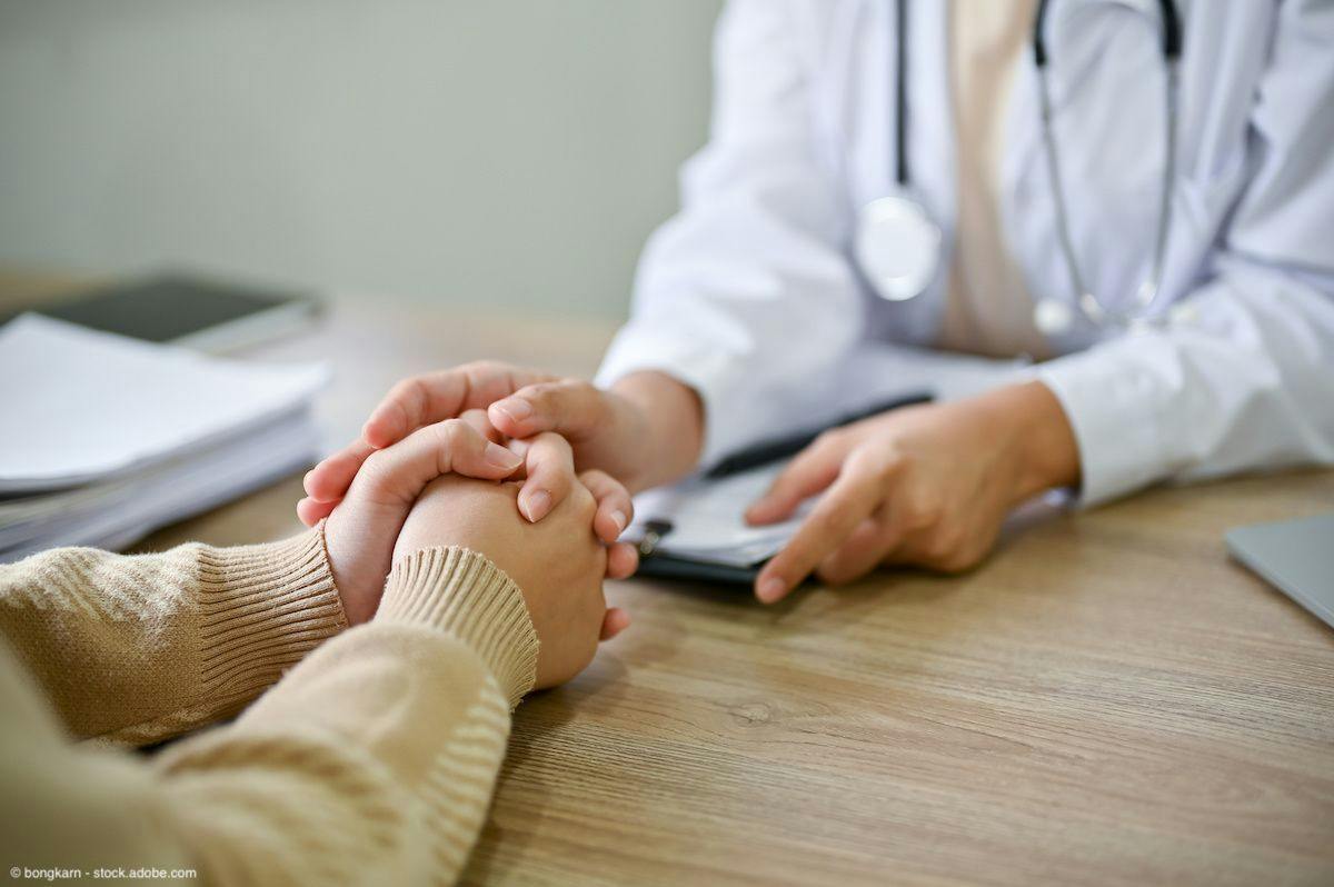 Doctor touching patient's hand | Image Credit: © bongkarn - stock.adobe.com